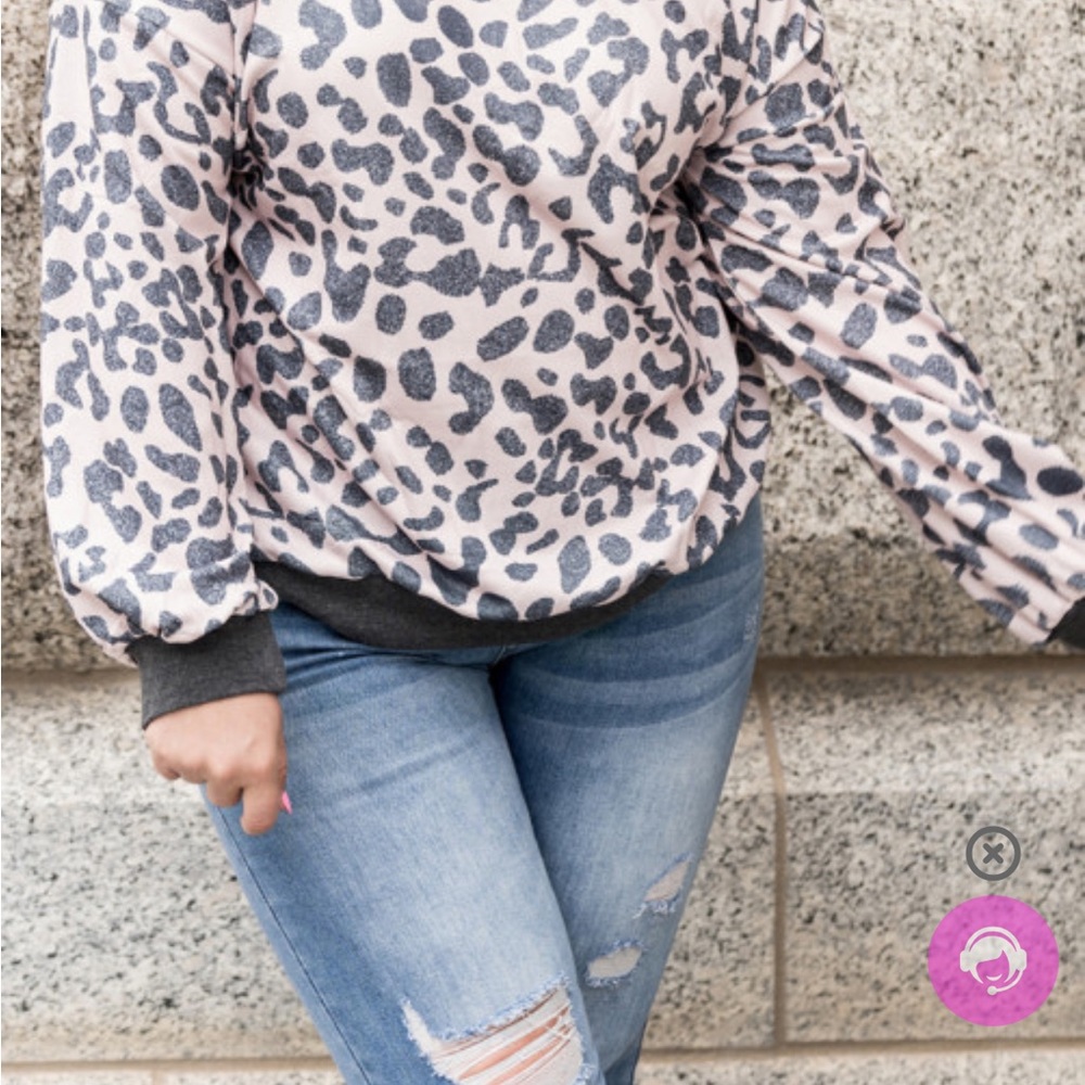 Gray and white animal print sweater.